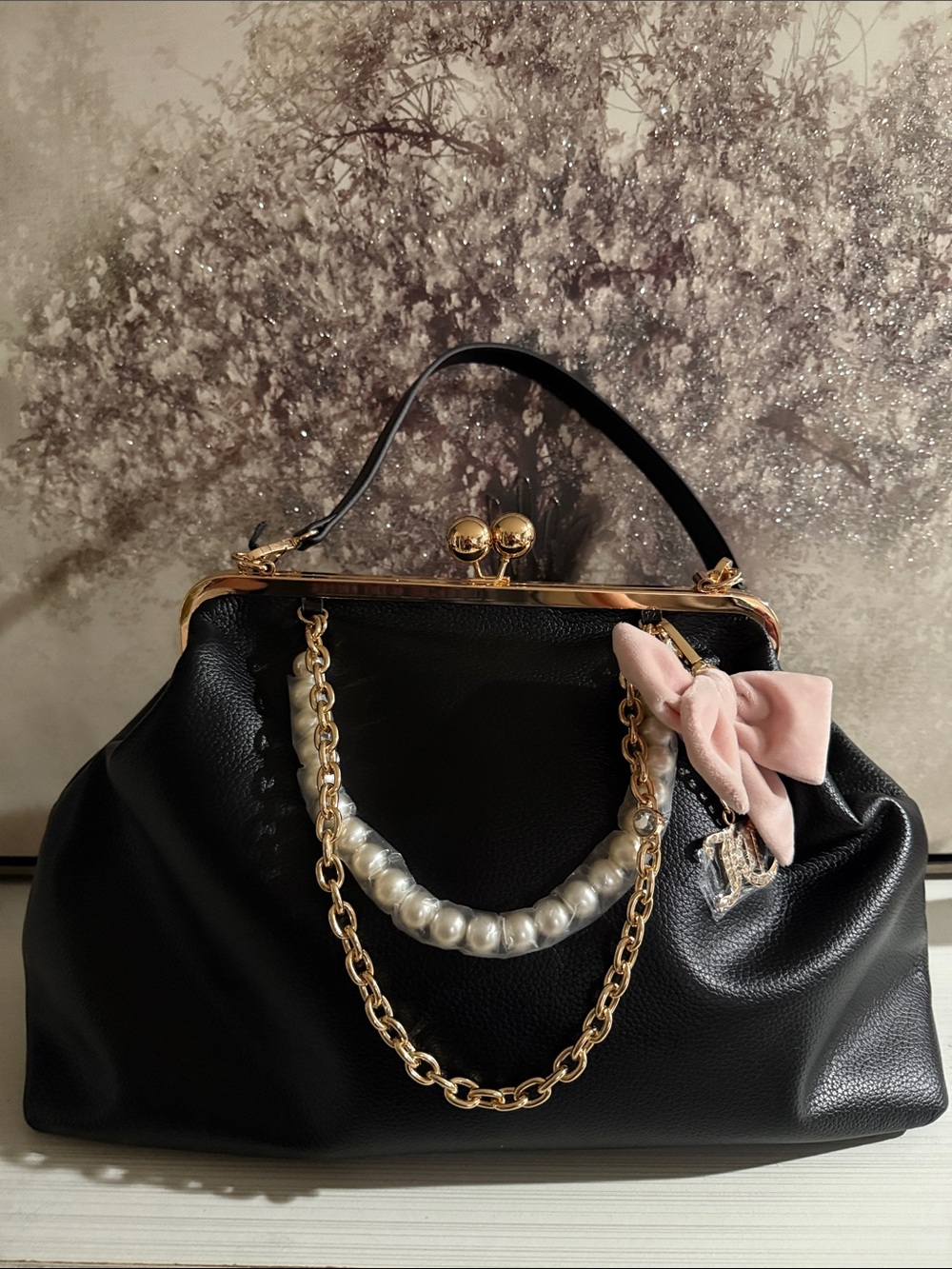 Juicy Couture kisslock handbag w/a prominent blush pink bow and pearl charm.$108 - Picture 2 of 10